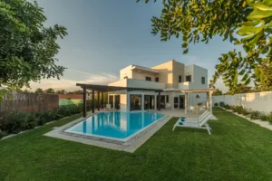 Modern house with garden swimming pool and wooden pergula